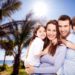 Happy young parents with two children