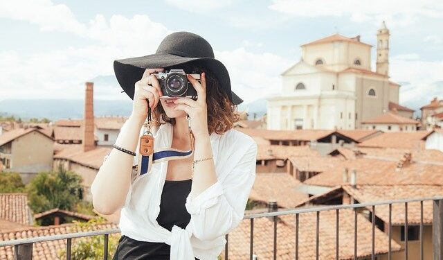 Travel girl with a camera