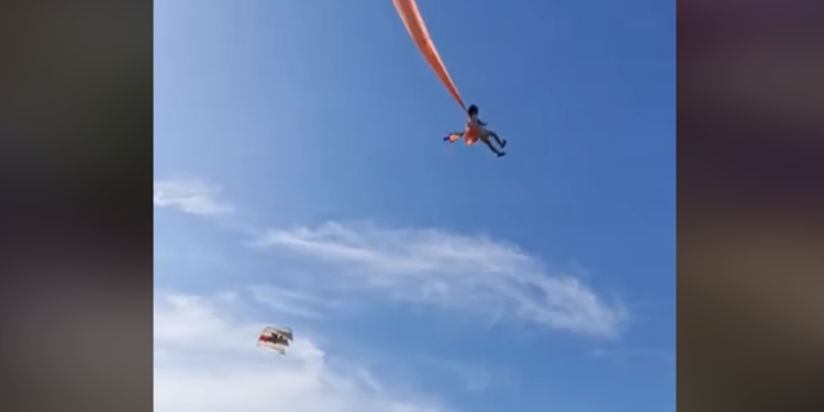 Girl flying with the kite