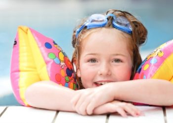 Cute child in a public swimming pool