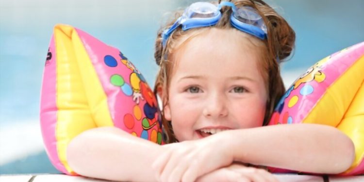 Cute child in a public swimming pool